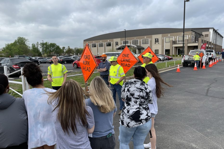 Oklahoma Department of Transportation workers lead students through a mock work zone at a recent event in Broken arrow. Students learn the meaning of various signs they might encounter when driving through a work zone as well as tips to help keep themselves and others safe while driving.